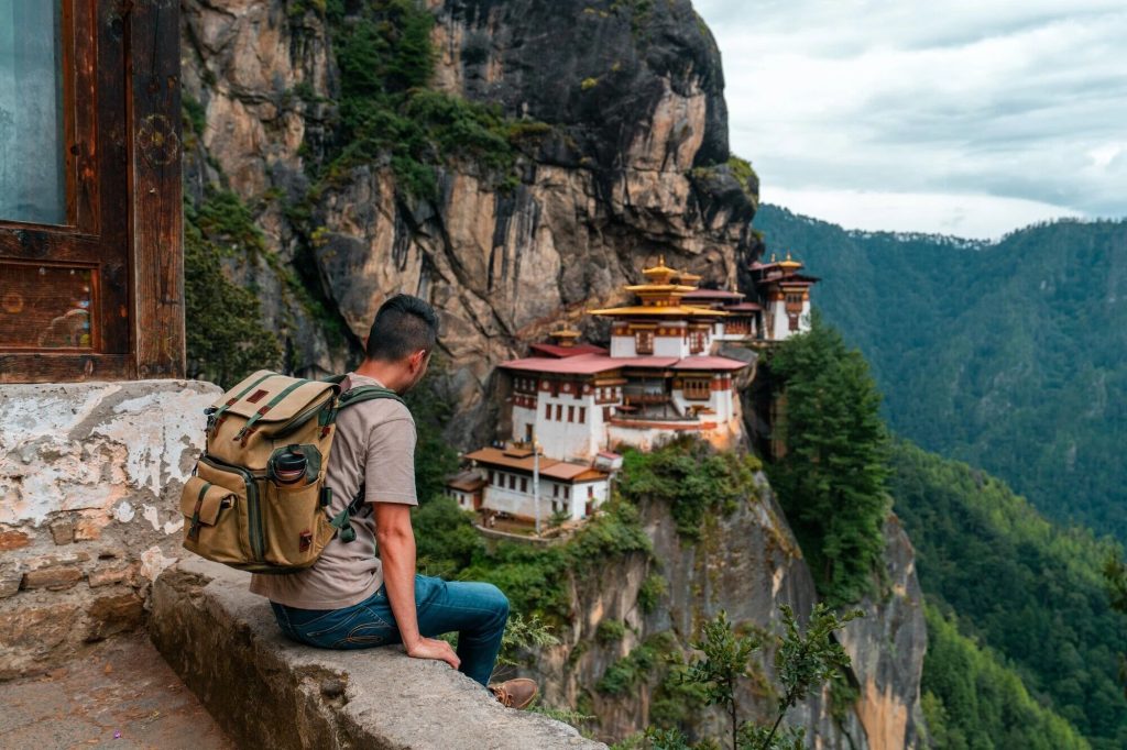 Tourist looking at the Paro Taktsang, Bhutan.
